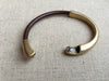 brown leather strap bracelet with antique brass clasp undone