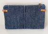 Navy Waxed Denim crossbody pouch bag with leather straps on a white background